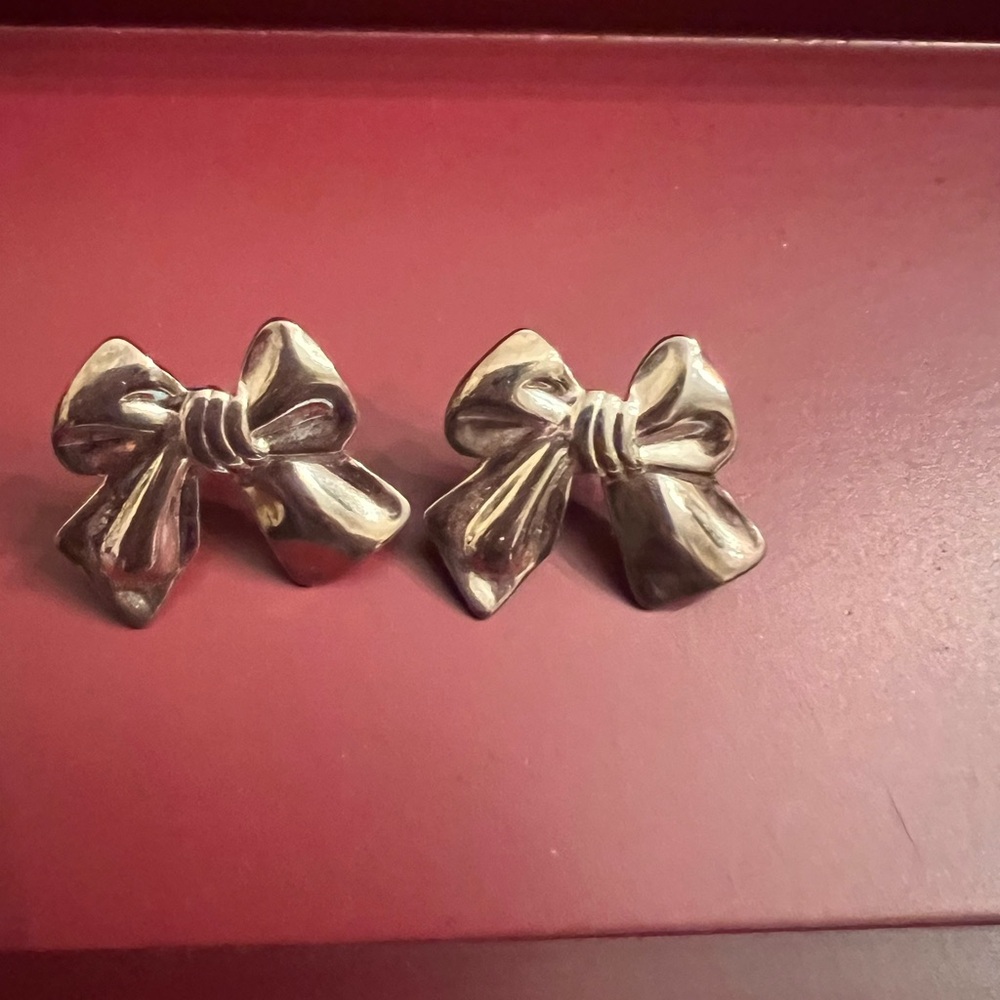 Silver tone bow earrings post style